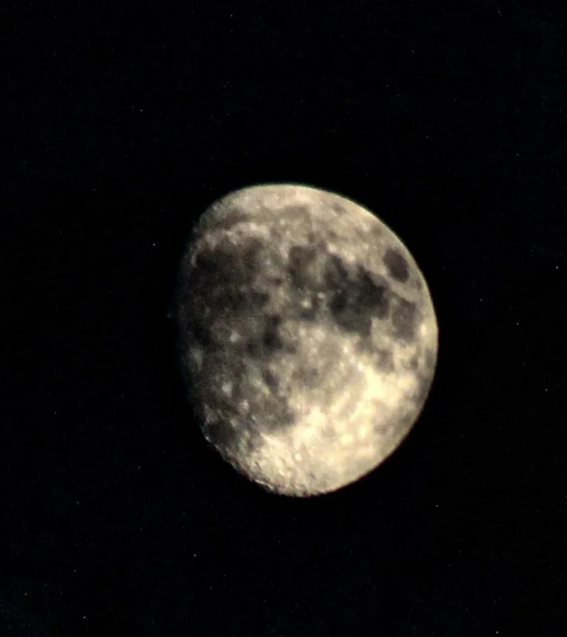 Bright full moon against a black night sky