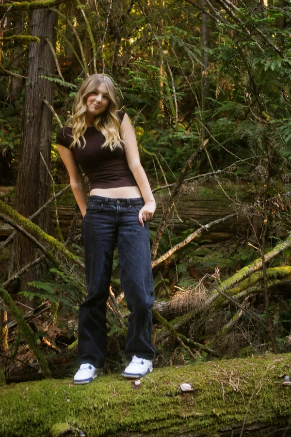 Lynden standing and smiling in warm outdoor light